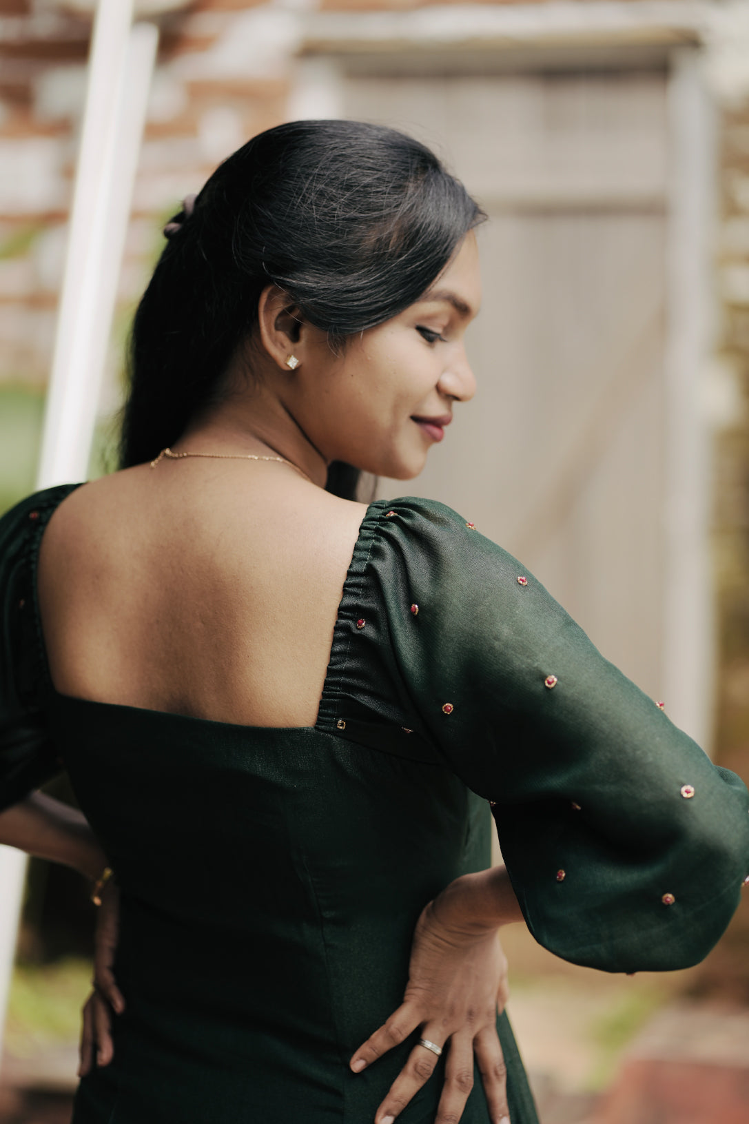 Emerald in emerald green showing aline dress and design