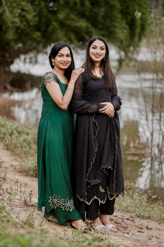 Bottle green Mul Chanderi slitted salwar with intricate cut work and cap sleeves