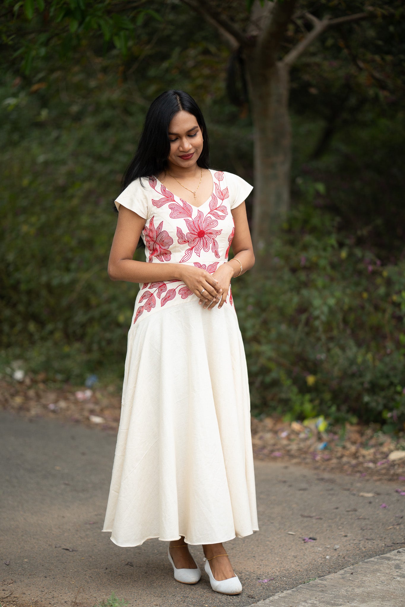 Serene back view showing umbrella frock with special yoke pattern construction