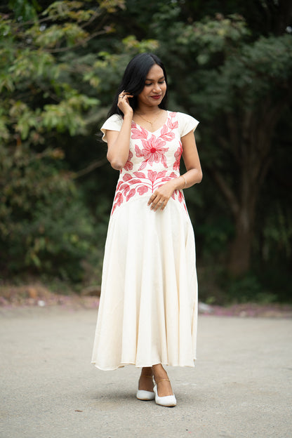 Serene side view showing flowing umbrella frock with special yoke pattern