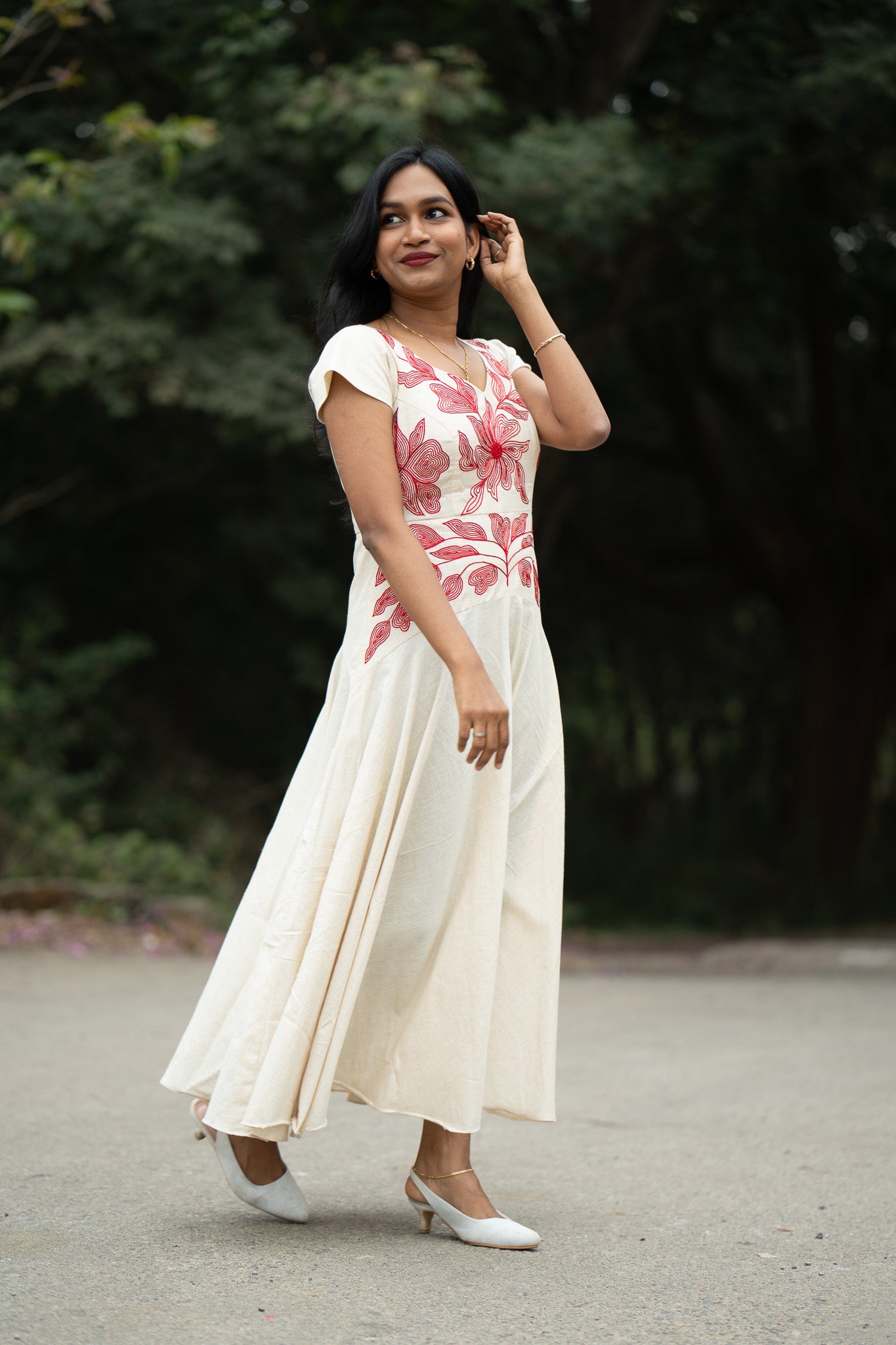 Serene off white with red hand embroidery umbrella frock with special yoke pattern with floral hand embroidery on yoke - front view