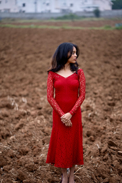 Scarlet red lace gown showing elegant mermaid-cut shape