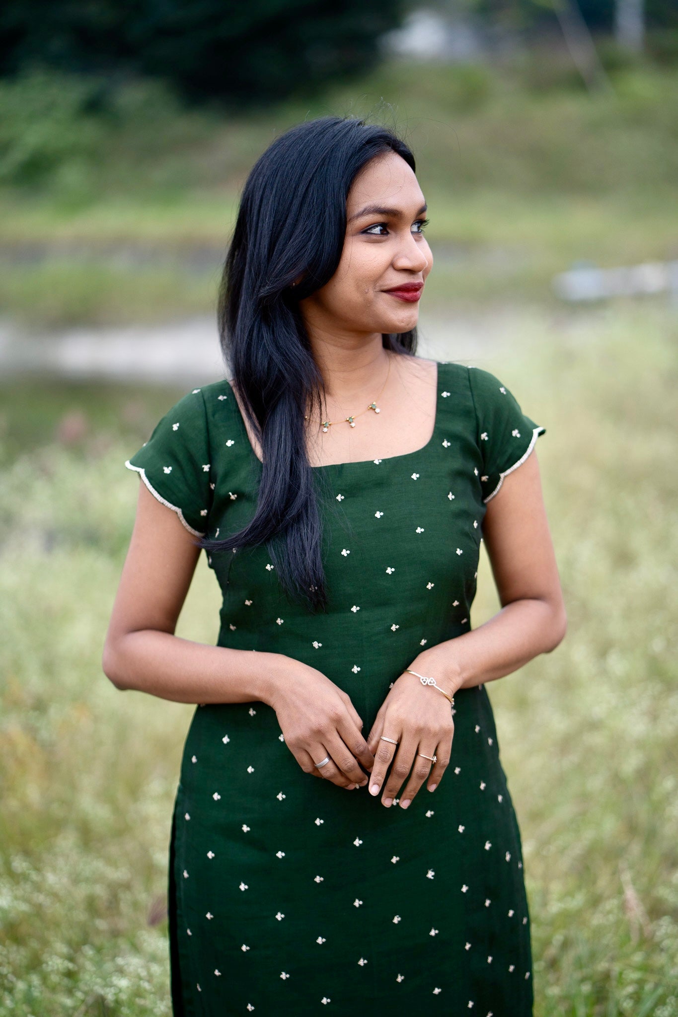 Esmera emerald green top and pant set with golden embroidered buttas - close-up view