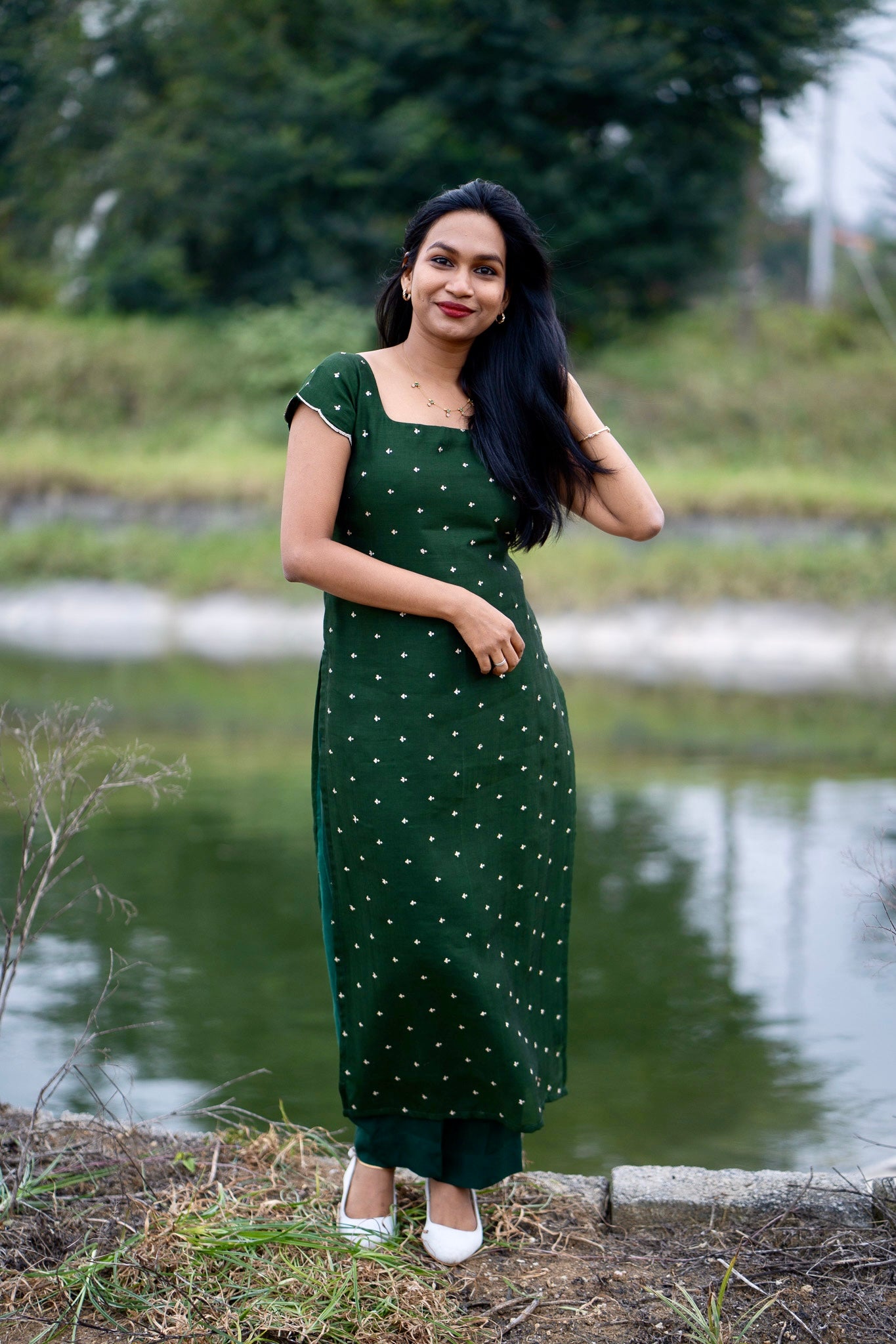 Esmera emerald green top and pant set with golden embroidered buttas - front view