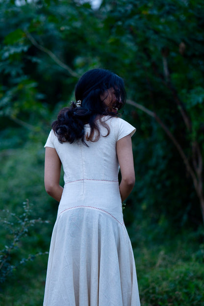 Taara handcrafted ivory dress showing fitted bodice and umbrella flare