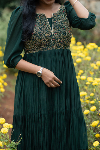 Zariya green anarkali showing flowy pleated silhouette and embroidered yoke
