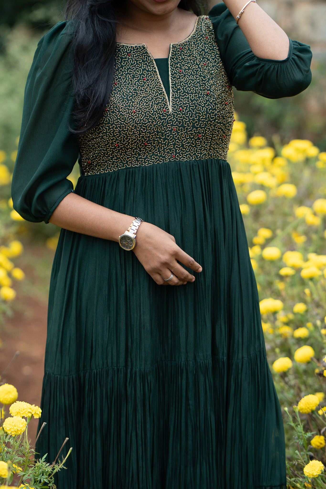 Zariya green anarkali showing flowy pleated silhouette and embroidered yoke