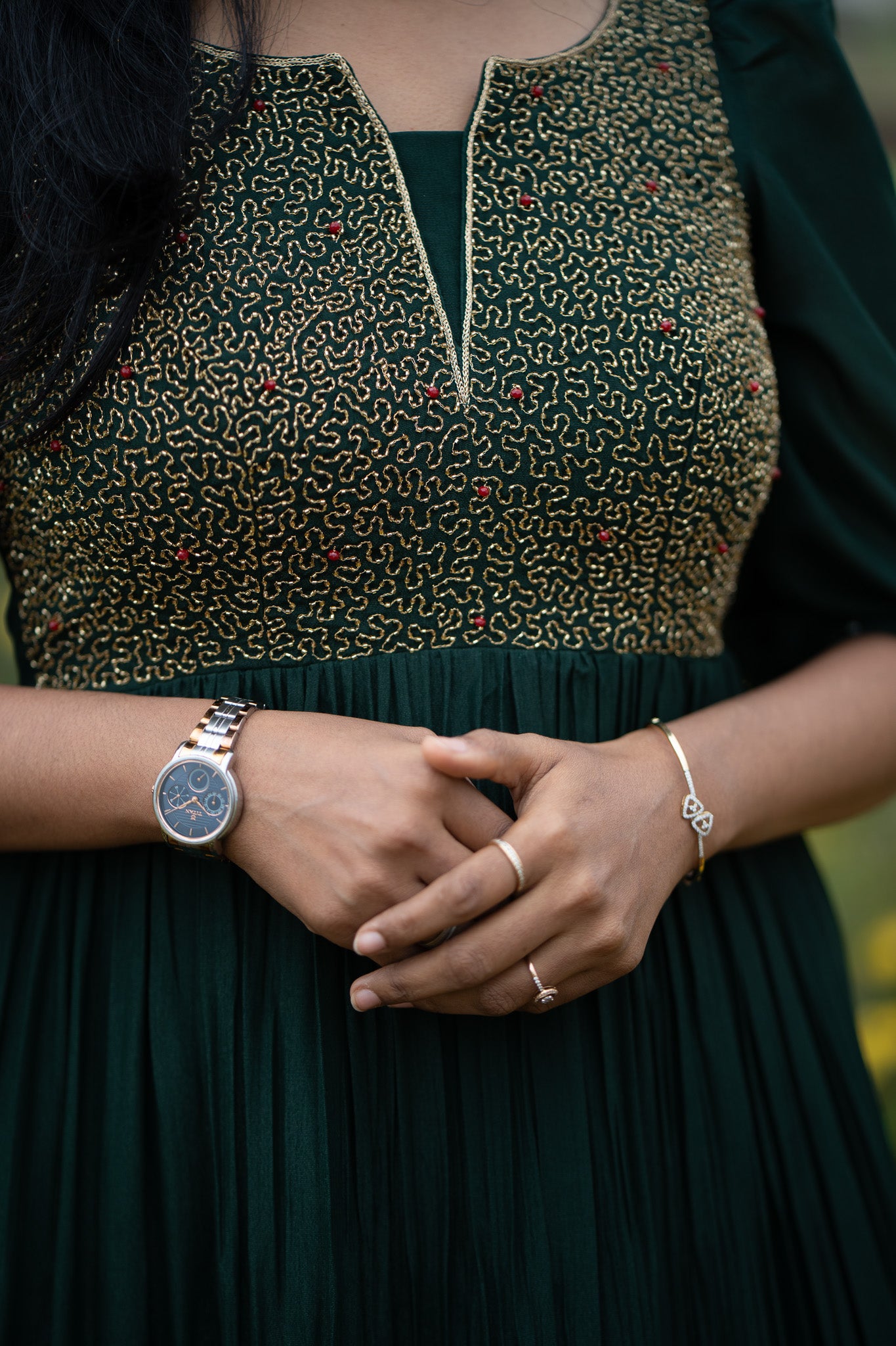 Zariya emerald dress styled for special occasion with hand-embroidered detail