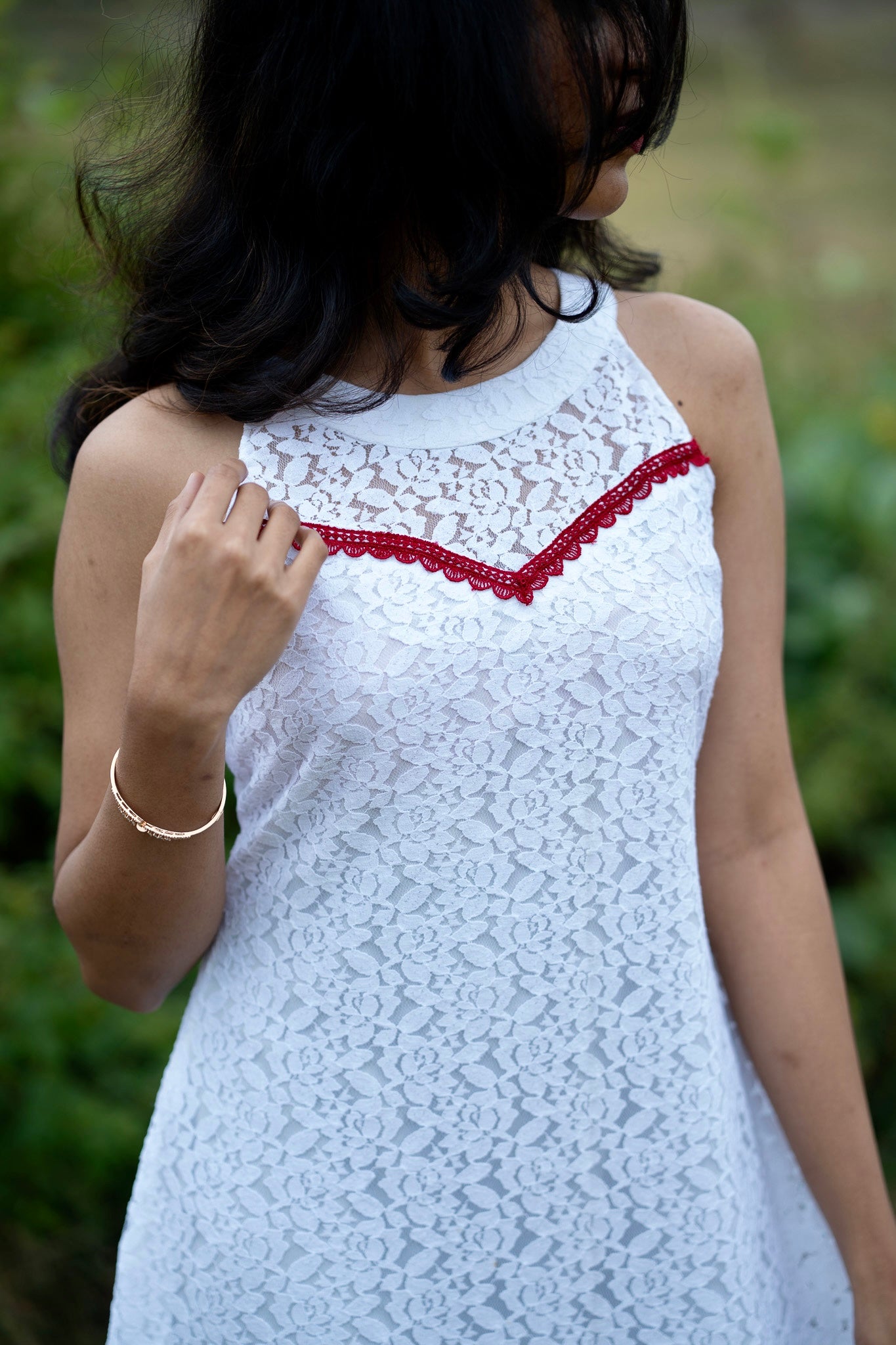 Roselle back view showing aline dress with red net gathers at the hem construction