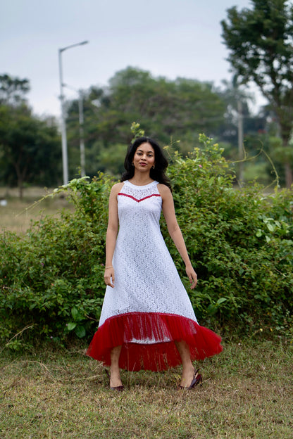 Roselle in white and red showing aline dress with red net gathers at the hem and design