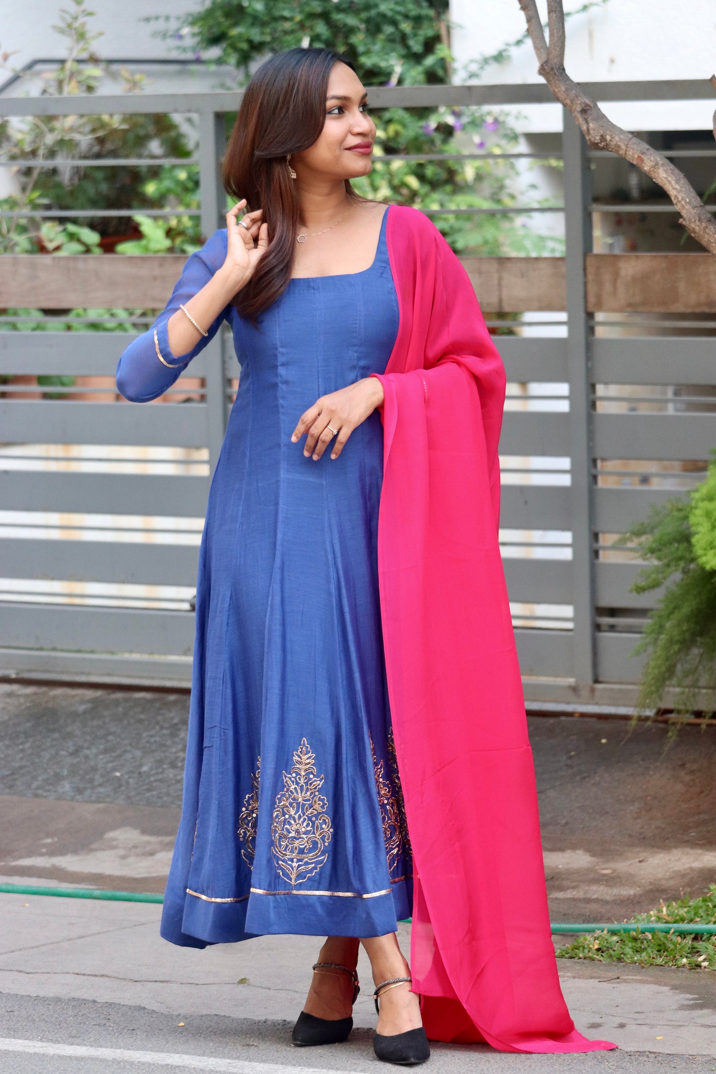 Neelika royal blue anarkali side view with graceful Mul Chanderi drape
