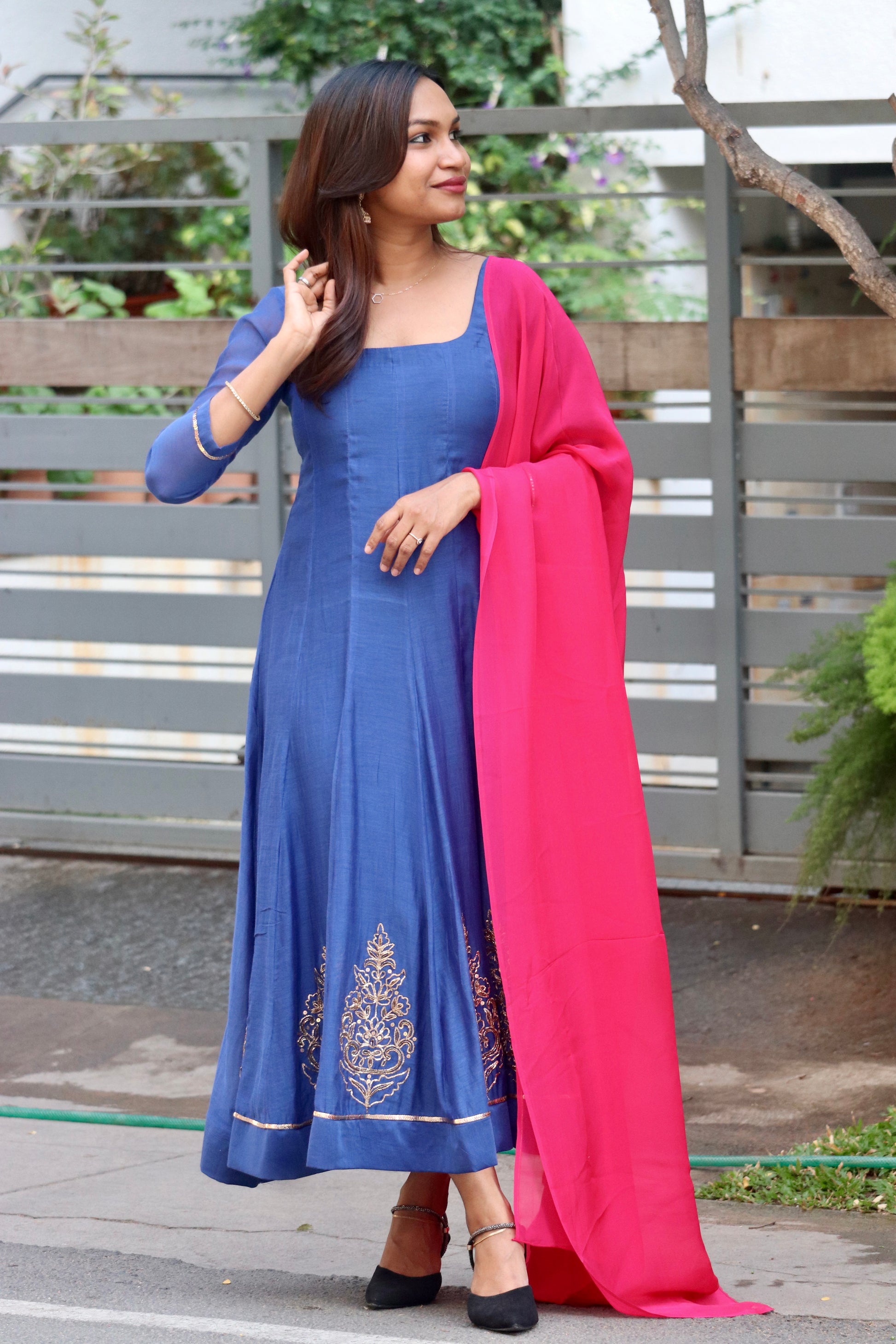 Neelika royal blue anarkali side view with graceful Mul Chanderi drape