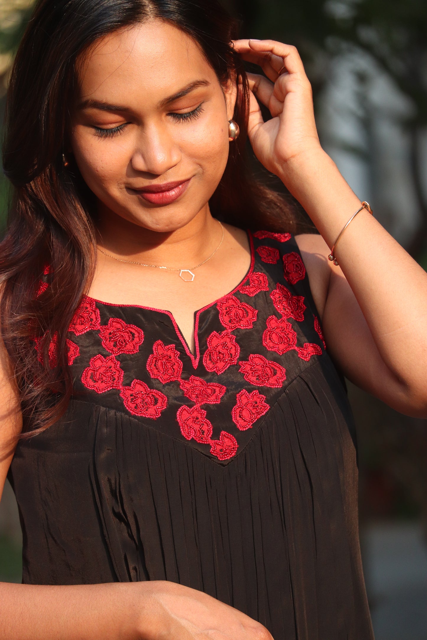 Noorika kurti close-up of red flower applique handwork on bodice