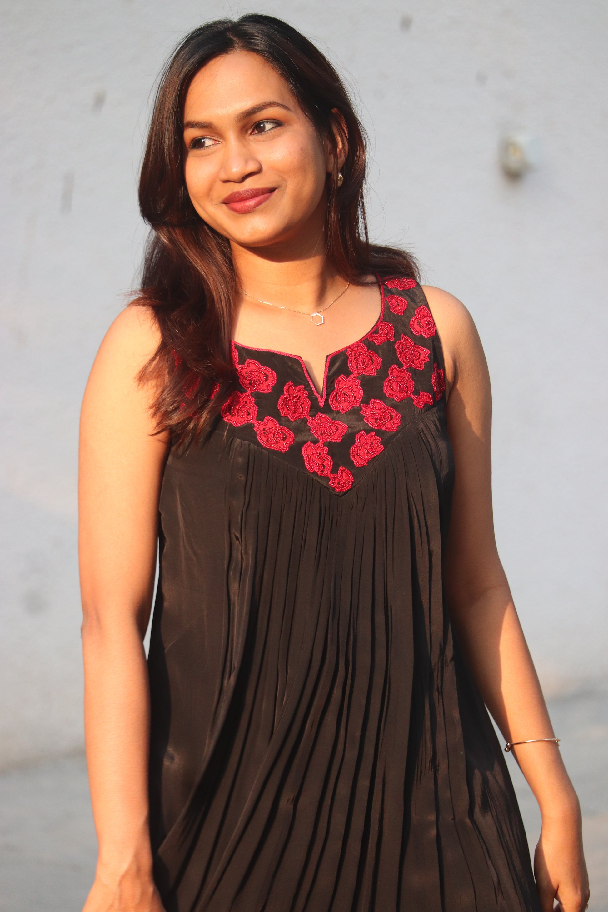 Noorika red and black A-line kurti in crepe silk with red flower applique handwork - front view