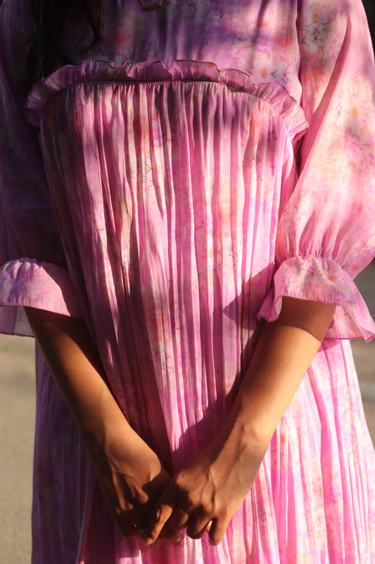 Close-up of mul chanderi floral print fabric with soft pleats