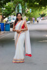 Vaidehi – Off White Mul Cotton Kerala Saree with Gold, Blue & Red Border