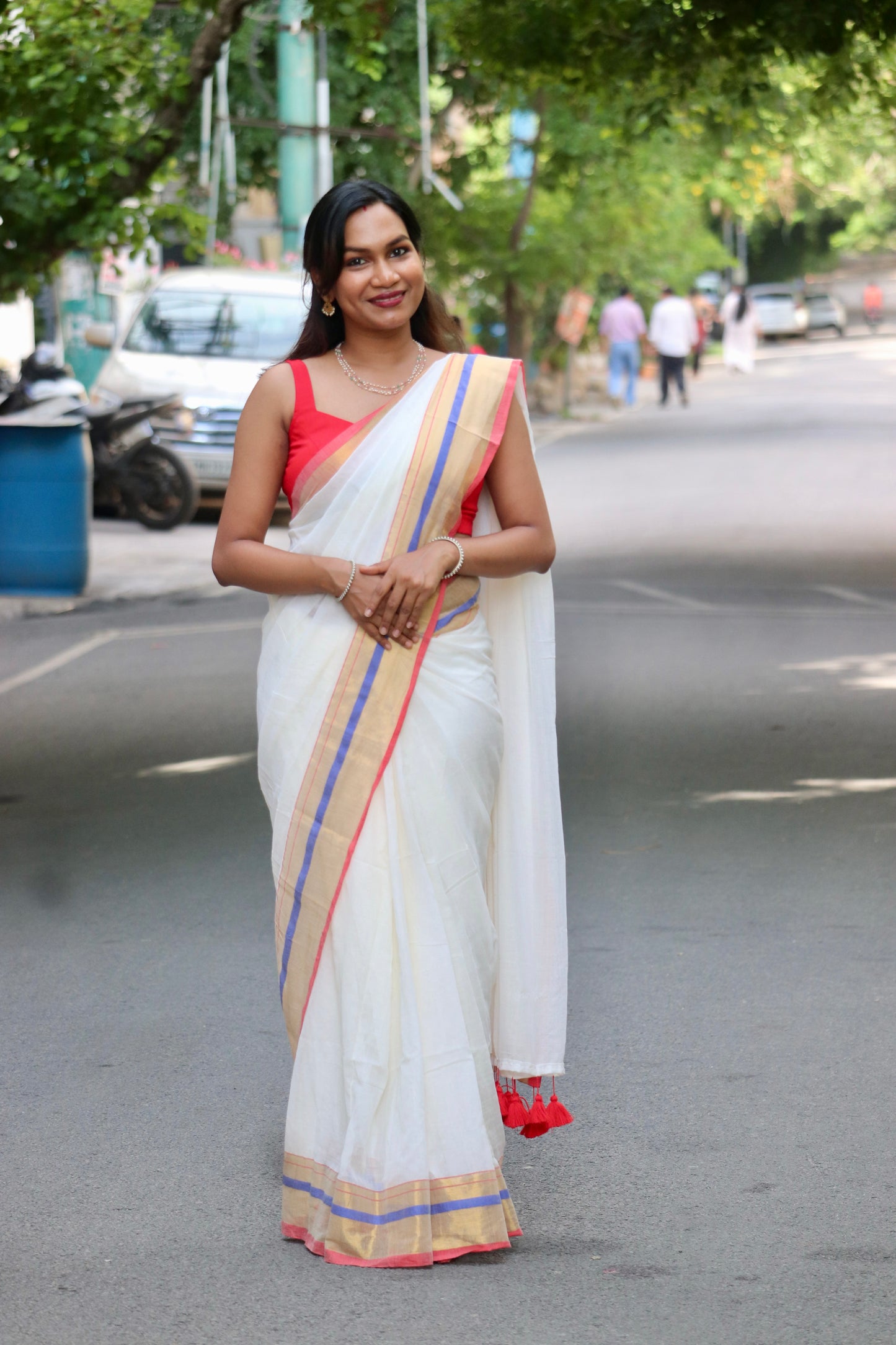 Vaidehi – Off White Mul Cotton Kerala Saree with Gold, Blue & Red Border