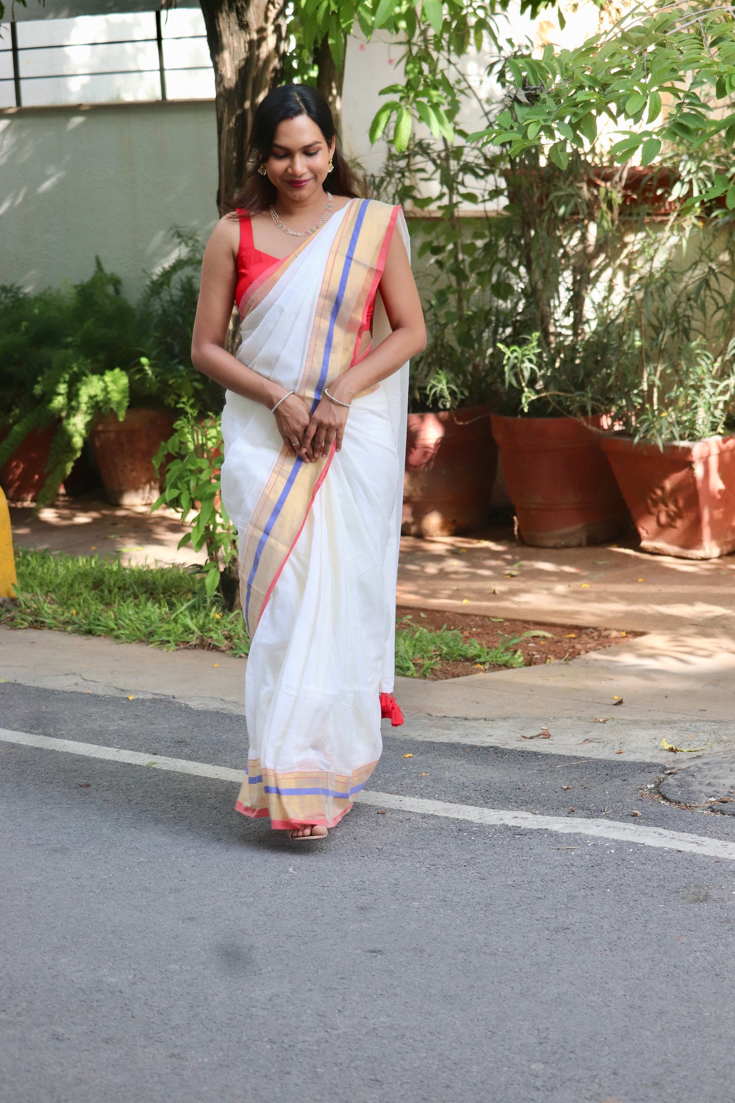 Vaidehi – Off White Mul Cotton Kerala Saree with Gold, Blue & Red Border