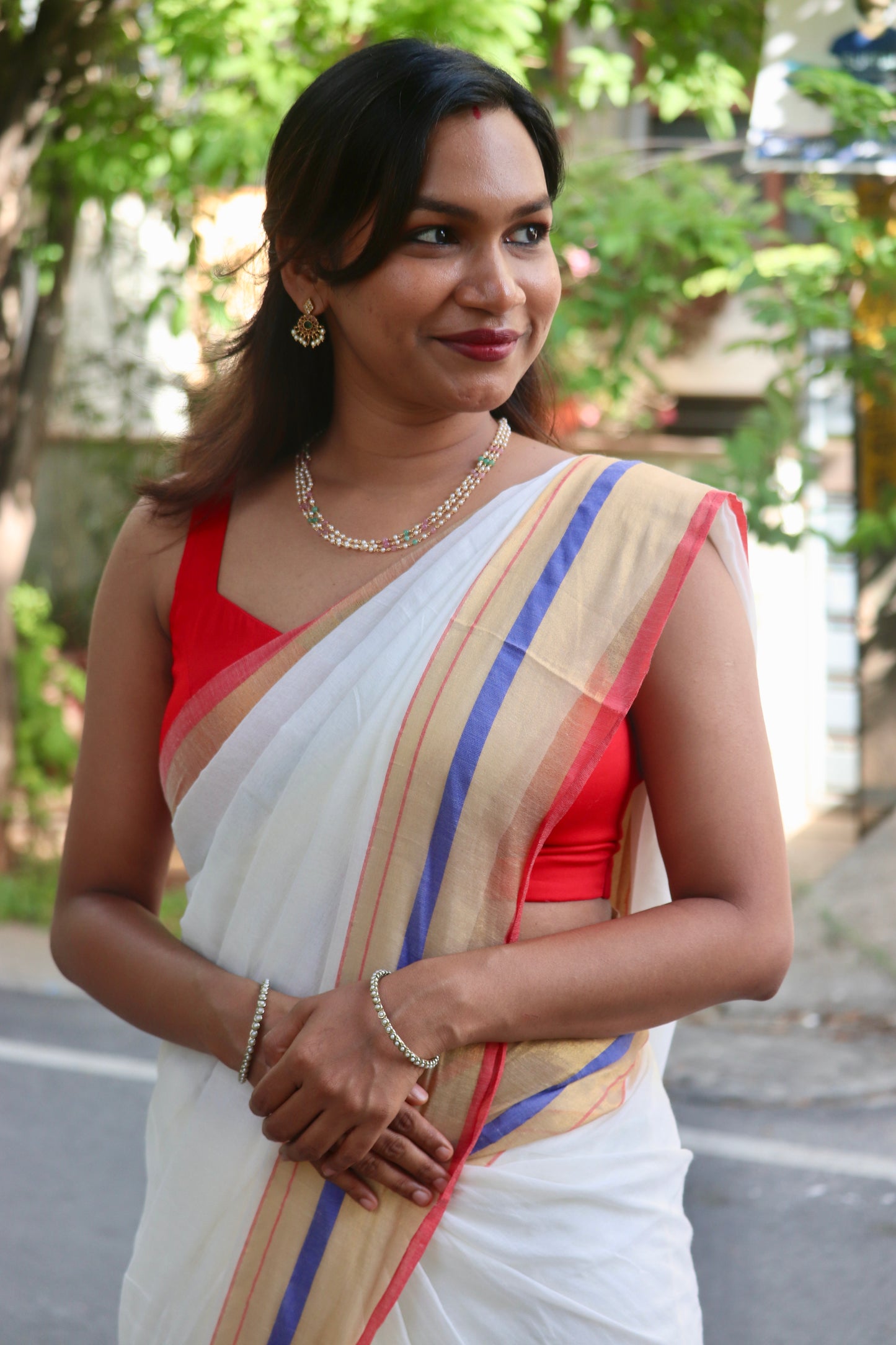 Vaidehi – Off White Mul Cotton Kerala Saree with Gold, Blue & Red Border