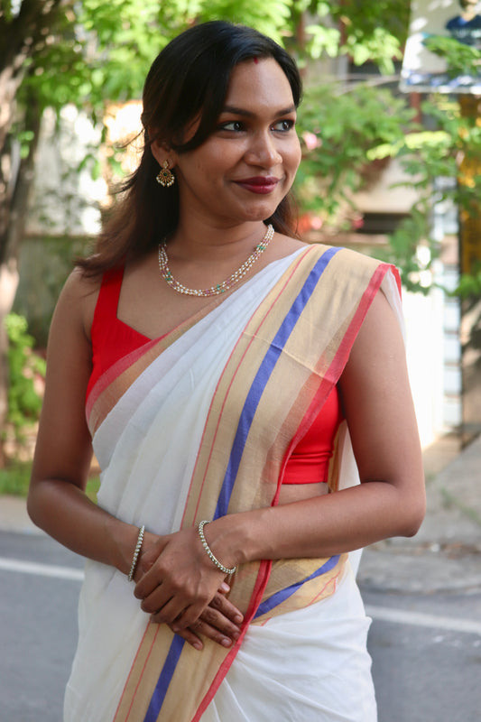 Vaidehi – Off White Mul Cotton Kerala Saree with Gold, Blue & Red Border