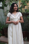Shankupushpam - Floral embroidered box pleated dress