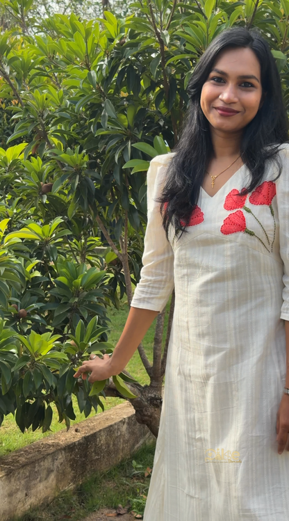 Blossom off white panel cut aline kurti with floral applique work on yoke - front view