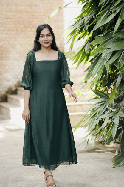 Emerald emerald green aline dress with red handwork on the sleeves - front view