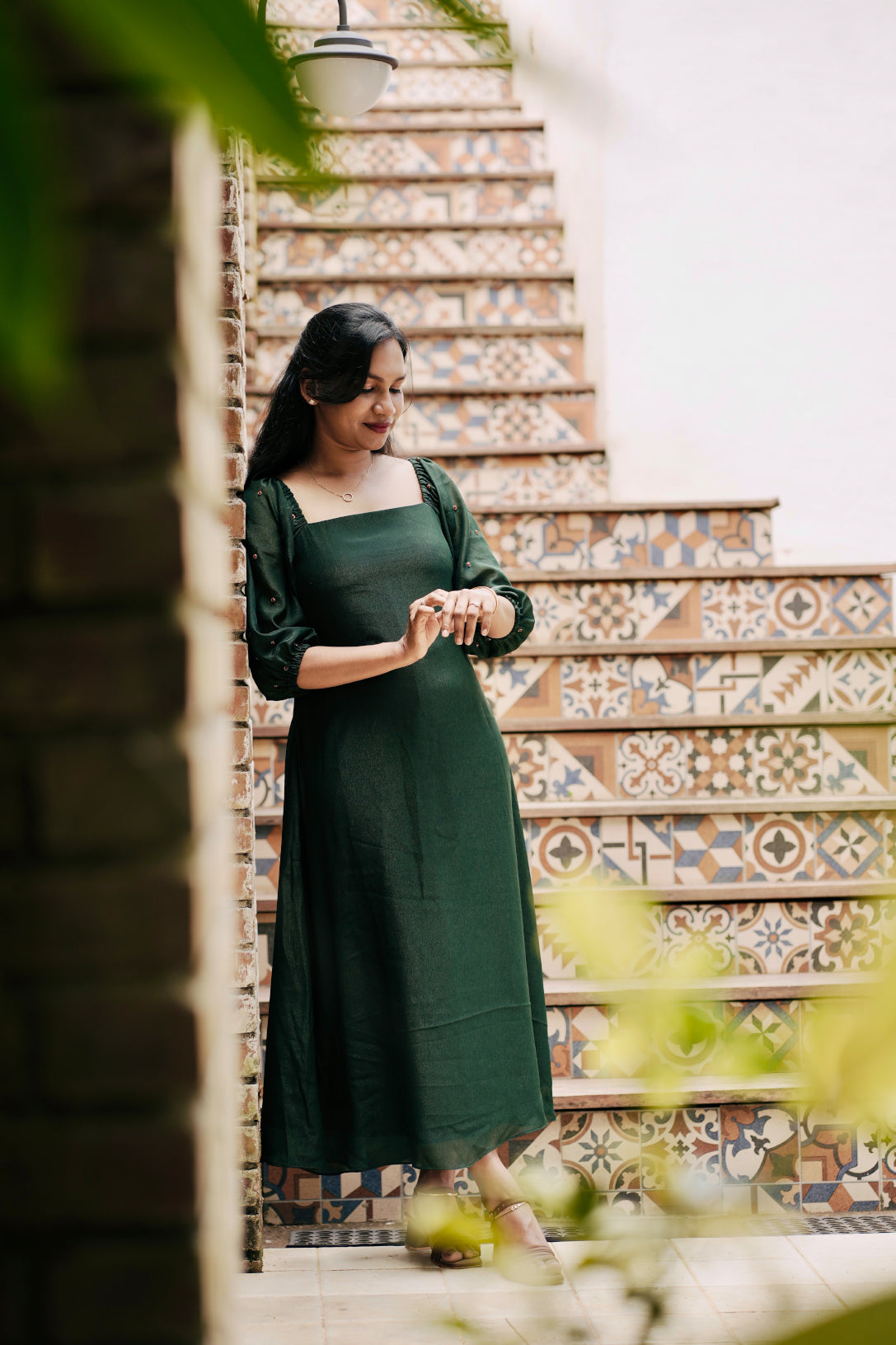 Emerald in emerald green showing aline dress and design