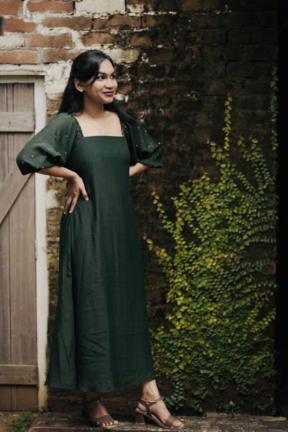 Emerald in emerald green showing aline dress and design