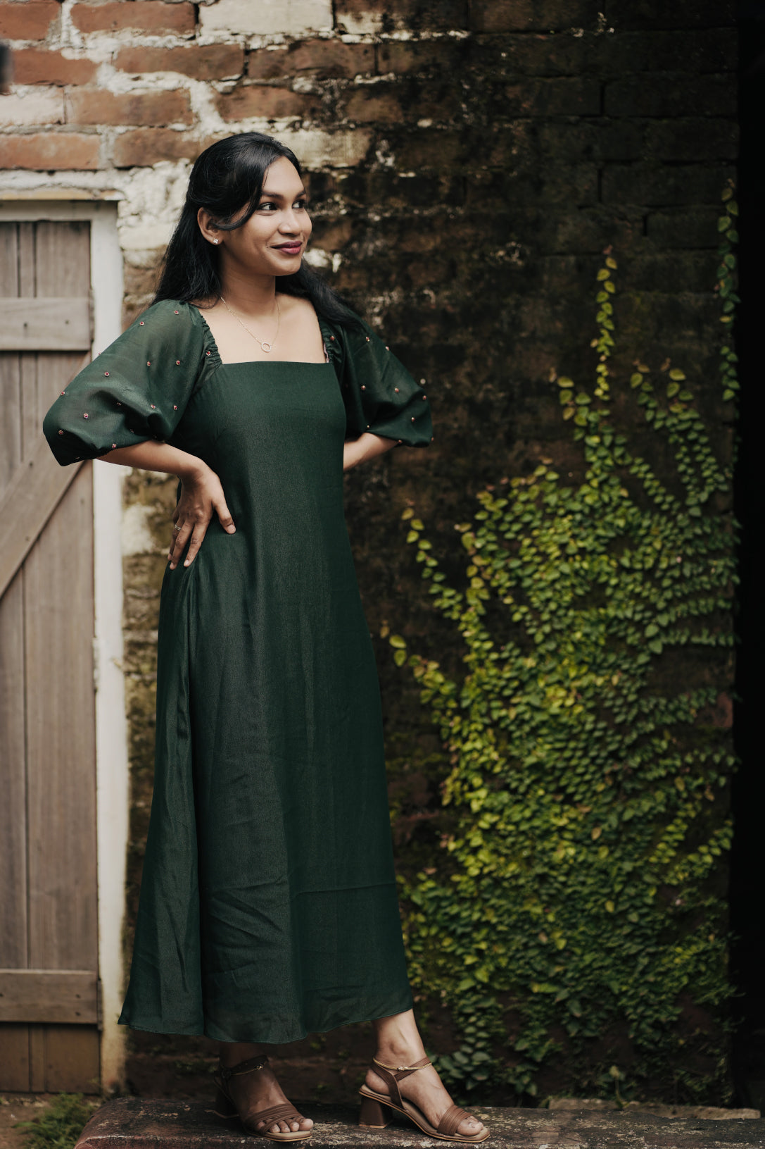 Emerald in emerald green showing aline dress and design