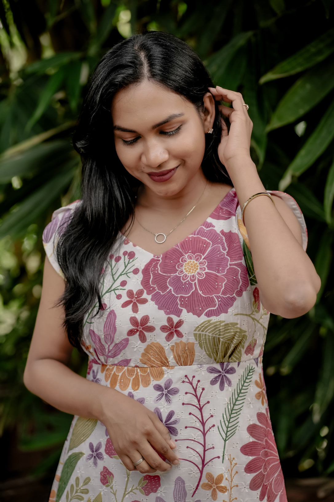 Meira side view showing flowing aline frock style dress