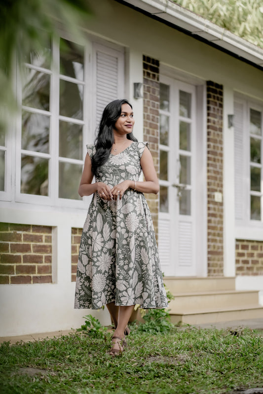 Olivia in white floral print showing umbrella cut dress and design