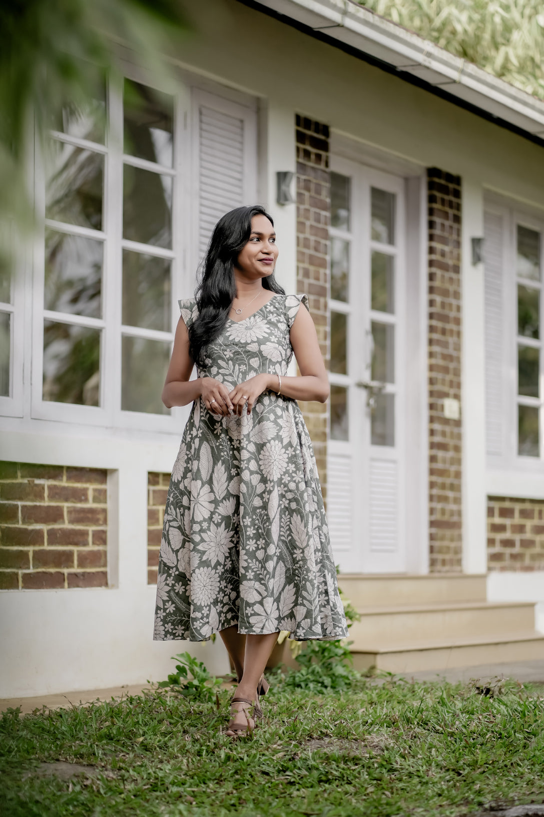 Olivia in white floral print showing umbrella cut dress and design