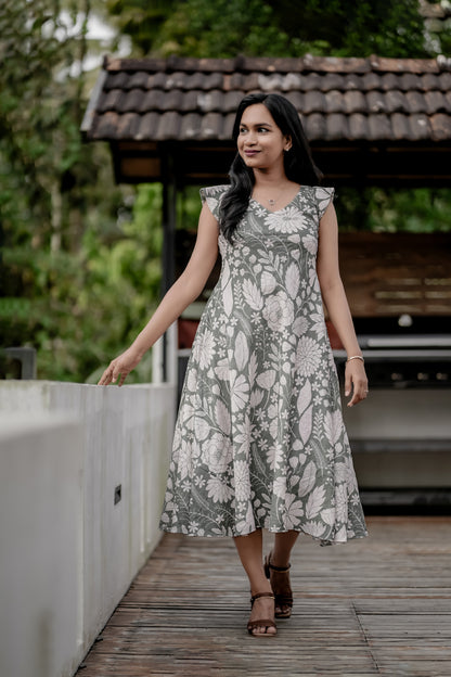 Olivia side view showing flowing umbrella cut dress