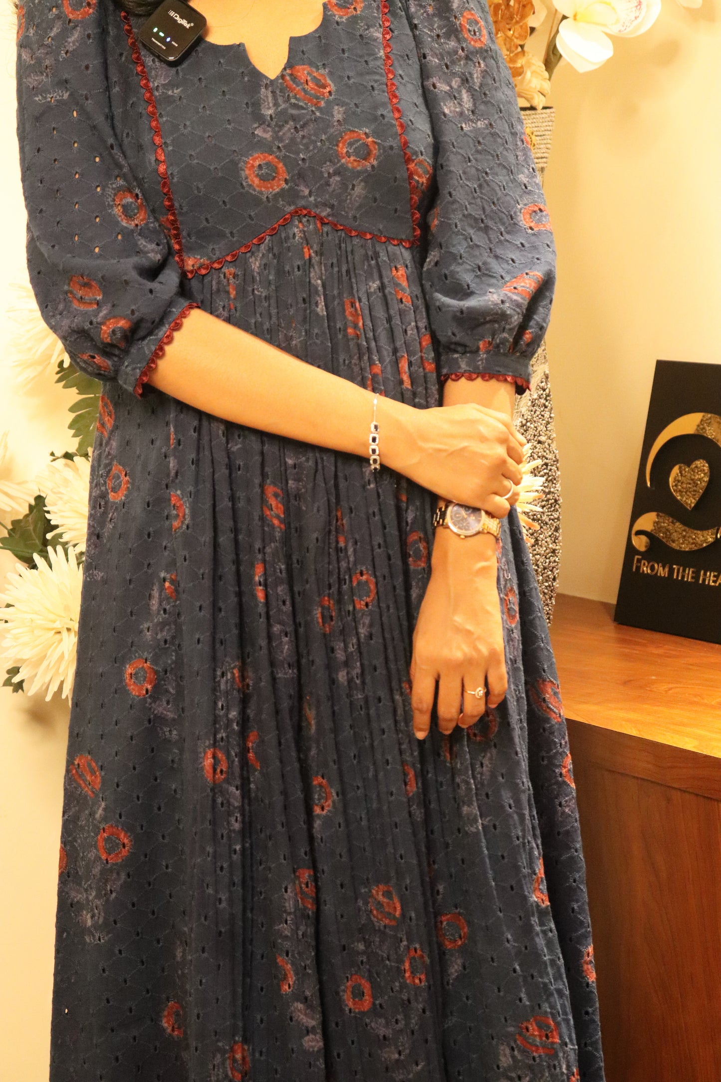 Indiraa kurti full-length view showing red hakoba block print pattern and gathered center front design