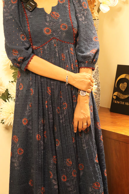 Indiraa kurti full-length view showing red hakoba block print pattern and gathered center front design