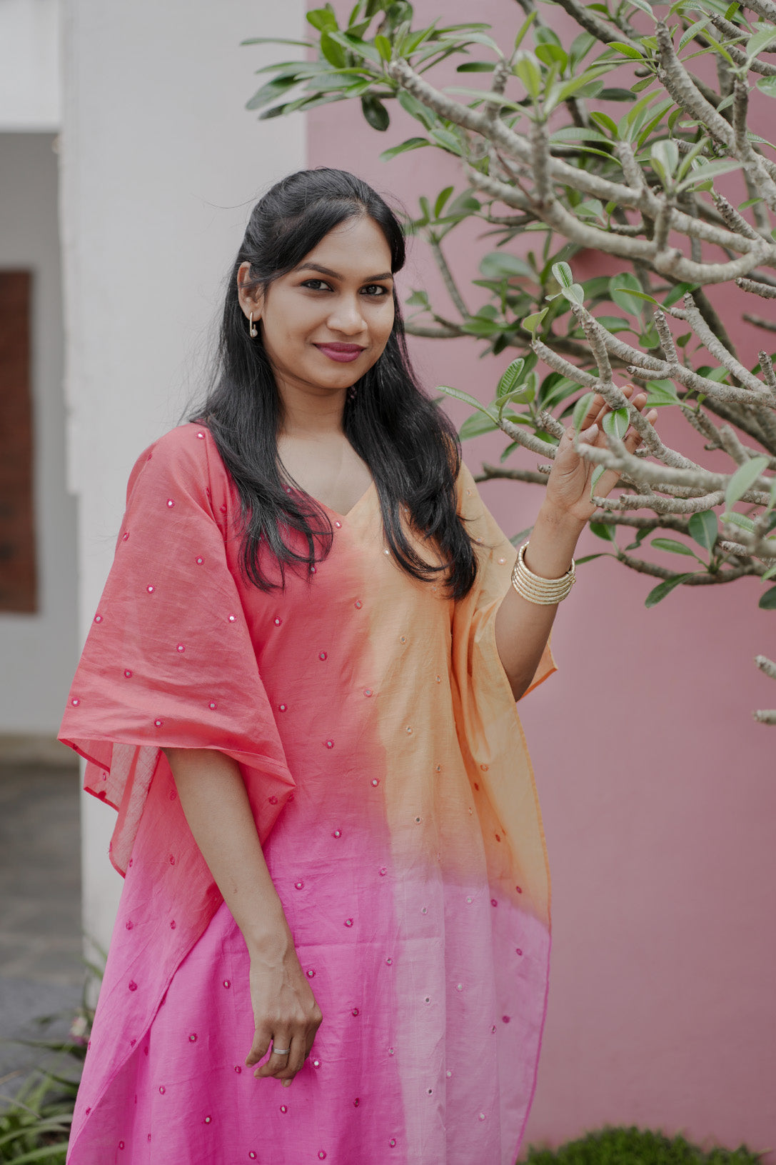 Aarza chanderi multicolor kaftan with mirror work and curved V neck in peach and pink hues
