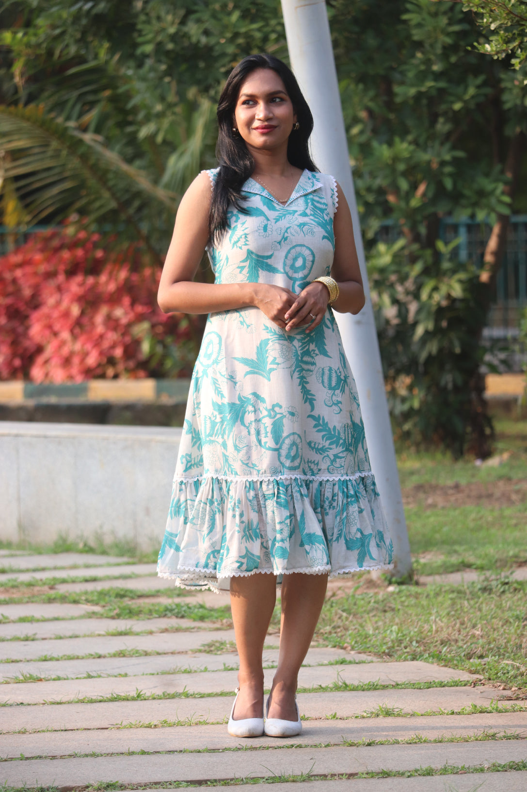 Petal linen A-line dress full-length view showcasing ruffled hem and Aija Blue floral pattern
