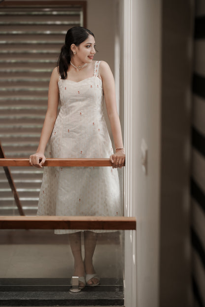 Aarohi off-white Chanderi dress full-length view on staircase with embroidered details