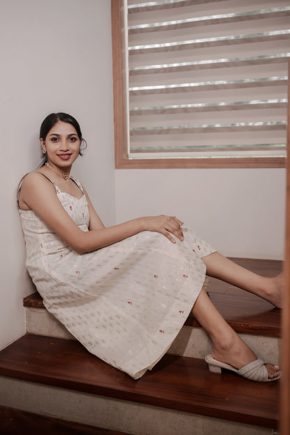 Woman sitting in Aarohi Chanderi dress showing embroidered details and comfortable fit