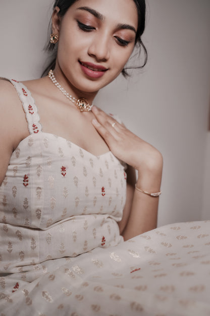Aarohi Chanderi dress with red embroidered motifs and pearl necklace