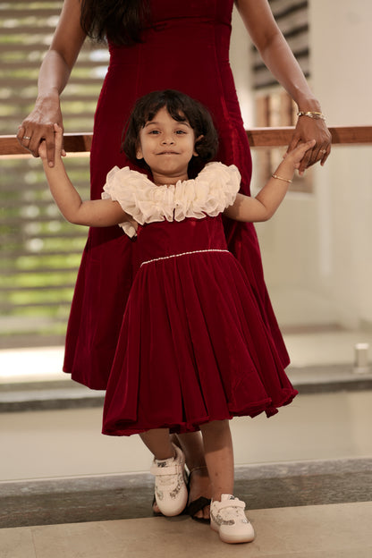 Mom red velvet mermaid dress close-up of off-shoulder neckline and sleek fit