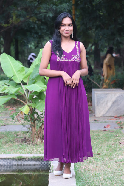 Woman wearing Viola dark purple viscose georgette kurti with handwork embroidery, full-length view standing outdoors near greenery