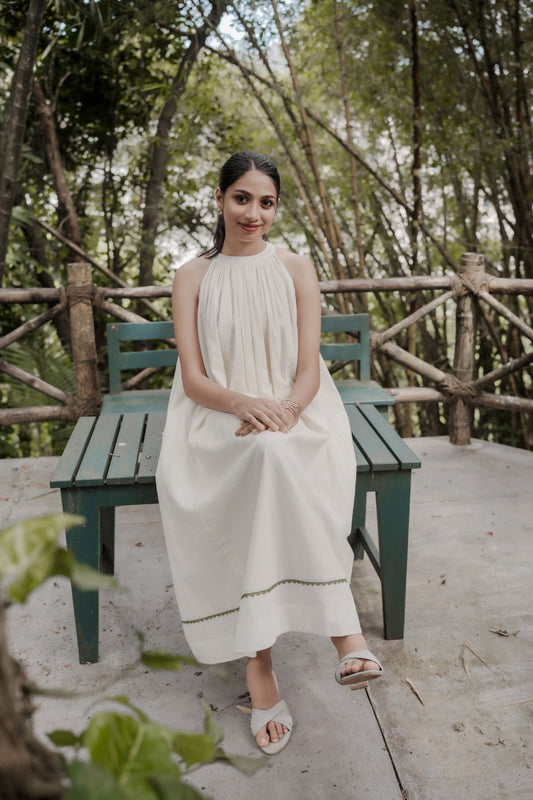 Selin in off white showing gathered aline dress and design
