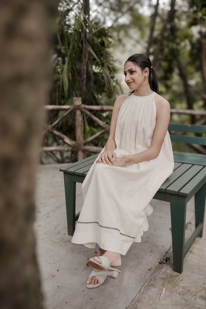 Selin side view showing flowing gathered aline dress