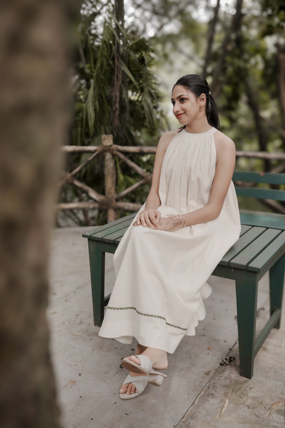 Selin side view showing flowing gathered aline dress
