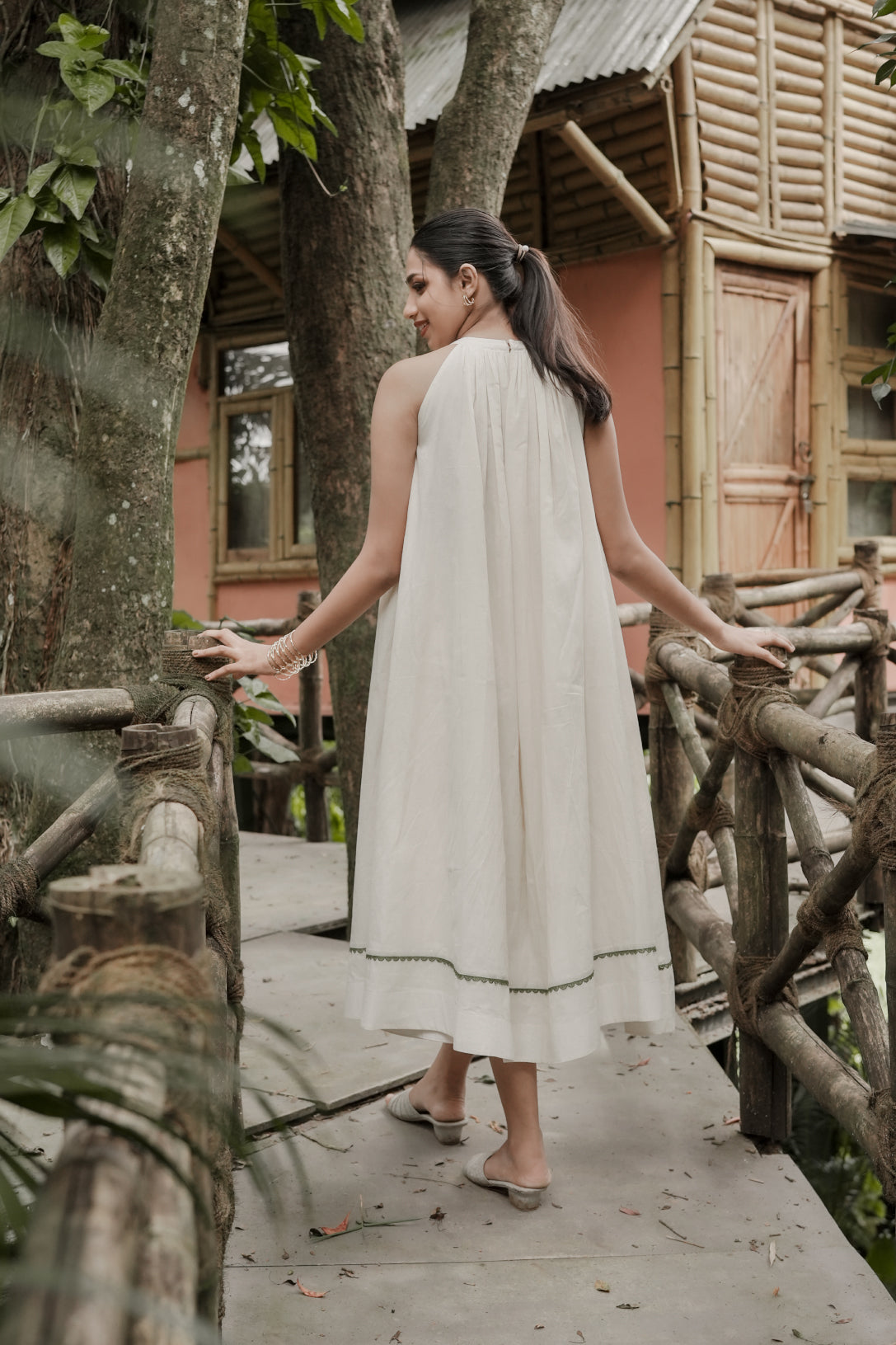 Selin off white gathered aline dress with olive green lace detailing at the hem - front view