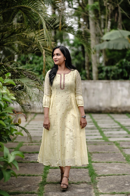 Sunhera light yellow 3 panel with side gathers with red handwork details on neck and center panel - front view