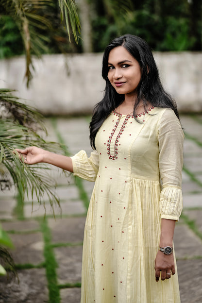 Sunhera close-up of red handwork details on neck and center panel detailing