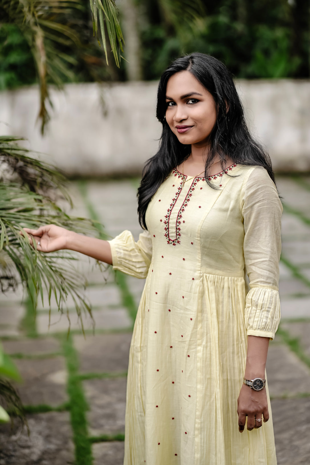 Sunhera close-up of red handwork details on neck and center panel detailing
